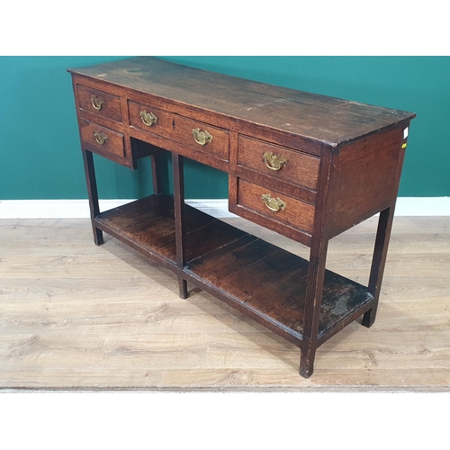 888 - An antique oak small Dresser Base fitted five drawers on reeded supports and potboard base, 4ft 4in ... 