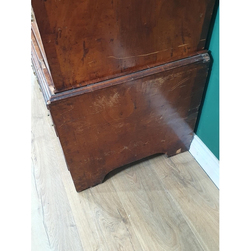 897 - An 18th Century figured walnut Chest on Chest, the moulded cornice above two short and three long dr... 