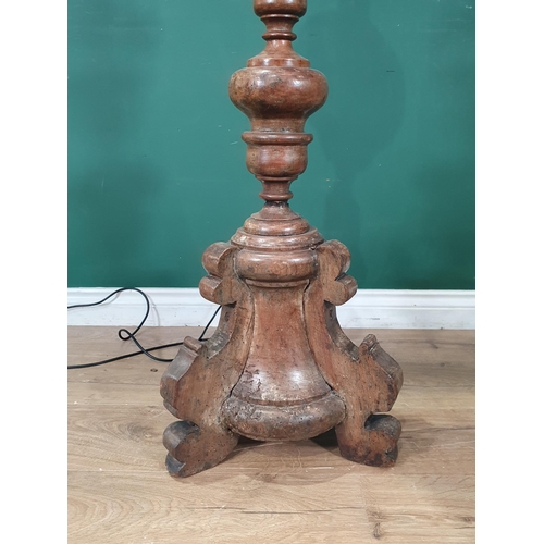 899 - An antique turned walnut Pricket type Standing Candlestick, fitted for electricity on three supports... 