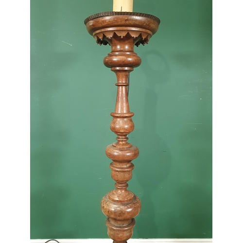 899 - An antique turned walnut Pricket type Standing Candlestick, fitted for electricity on three supports... 