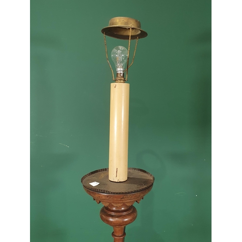 899 - An antique turned walnut Pricket type Standing Candlestick, fitted for electricity on three supports... 