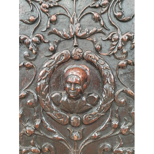 901 - A pair of Flemish 16th Century carved oak Panels with relief busts of a soldier and lady within trai... 