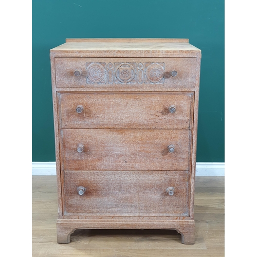 905 - A Heal's limed oak small Chest of Drawers, the top drawer with carved detail above three drawers on ... 