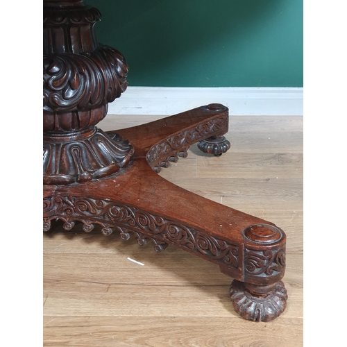 913 - A 19th century Colonial Centre Table with carved and moulded edge, the frieze carved leaves and rose... 