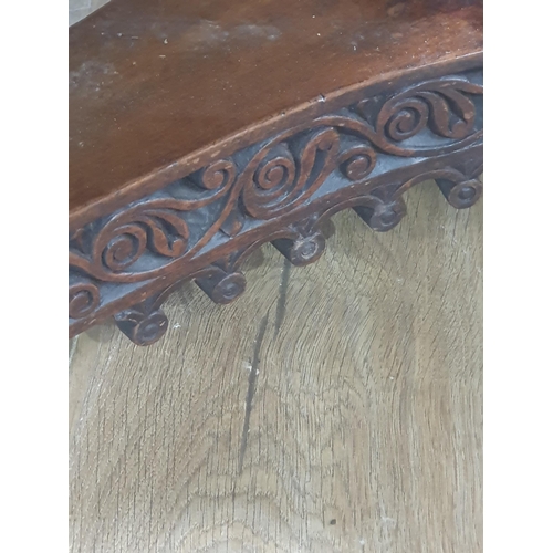 913 - A 19th century Colonial Centre Table with carved and moulded edge, the frieze carved leaves and rose... 