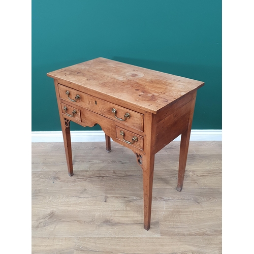 915 - An 18th Century fruitwood Lowboy fitted three drawers around a shaped frieze and pierced fret carved... 