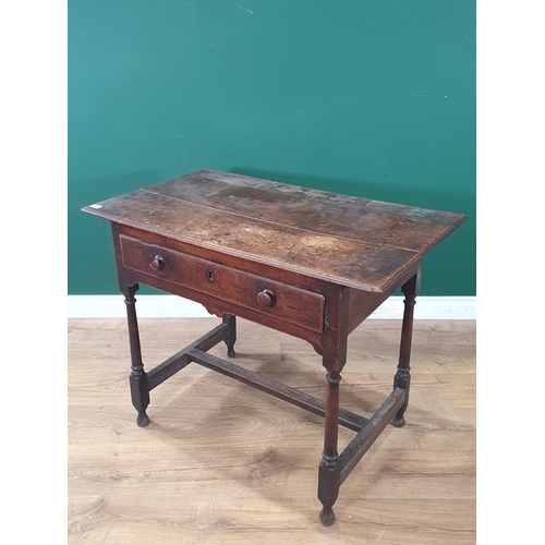 934 - An 18th Century oak Side Table with three piece top, single fitted drawer, above a shaped frieze, on... 