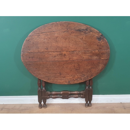 937 - A late 17th Century Coaching Table with elm oval top raised upon oak baluster and squared supports 3... 