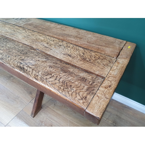 939 - An antique oak long Tavern Table with thick three-plank cleated top on cross frame supports with con... 