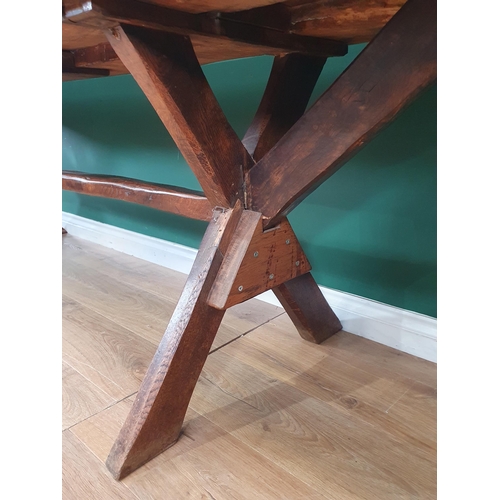 939 - An antique oak long Tavern Table with thick three-plank cleated top on cross frame supports with con... 