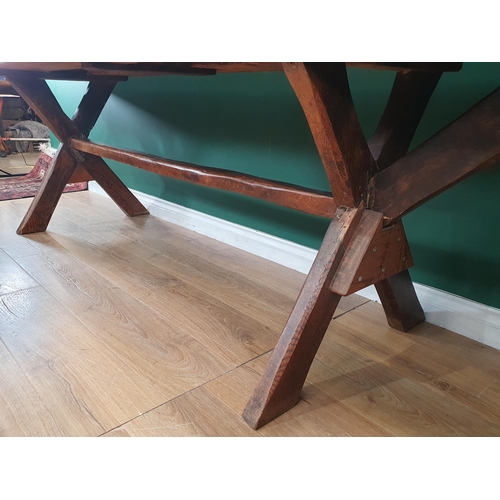 939 - An antique oak long Tavern Table with thick three-plank cleated top on cross frame supports with con... 