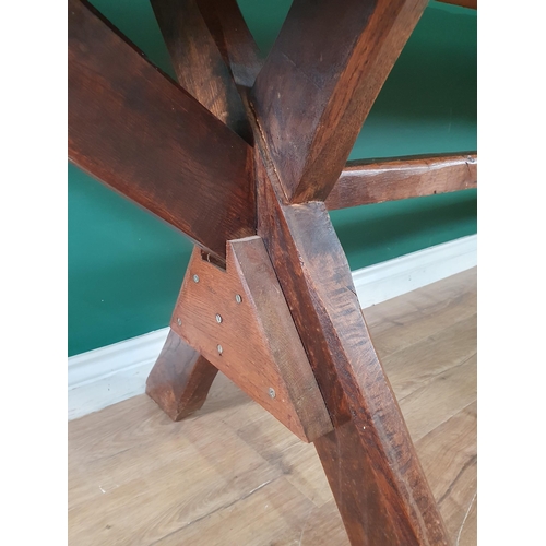 939 - An antique oak long Tavern Table with thick three-plank cleated top on cross frame supports with con... 