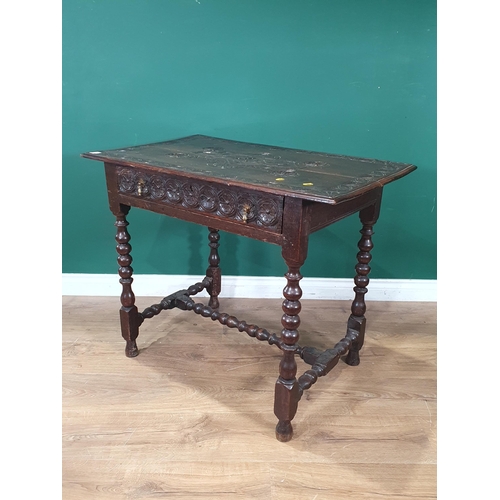 940 - An 18th Century oak Side Table with later carving, fitted frieze drawer on bobbin turned supports an... 