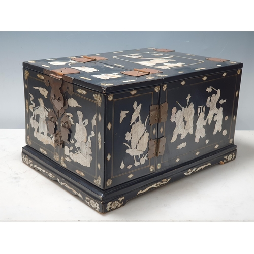 943 - An Oriental Cabinet fitted assorted small drawers and a folding mirror, decorated chinoiserie figure... 