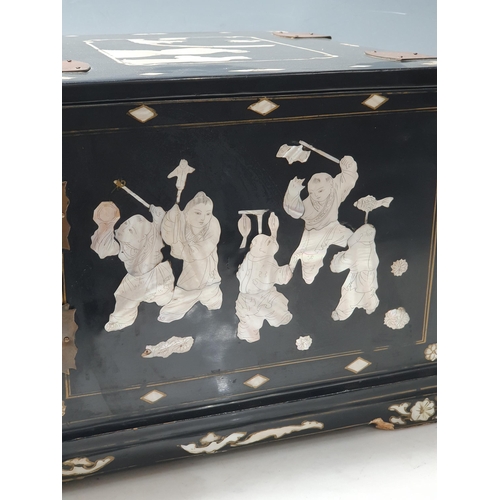 943 - An Oriental Cabinet fitted assorted small drawers and a folding mirror, decorated chinoiserie figure... 