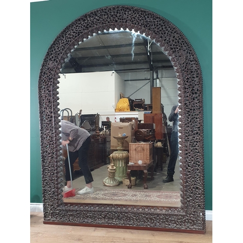 945 - A large impressive Burmese carved arched Mirror, with finely  pierced and carved frame of flowers an... 