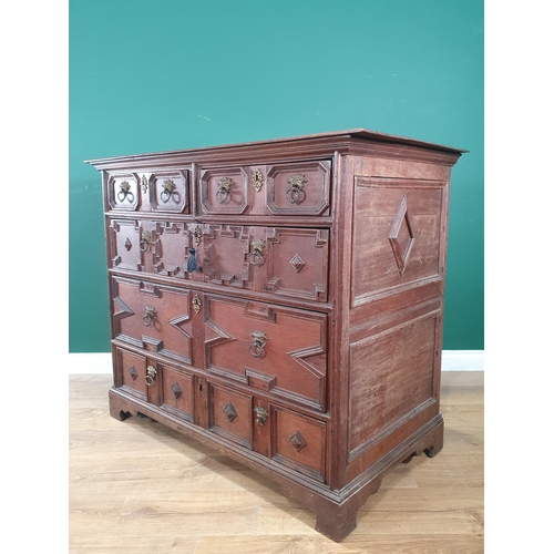 959 - An early 18th Century oak Chest of two short and three long drawers with moulded drawer fronts and m... 