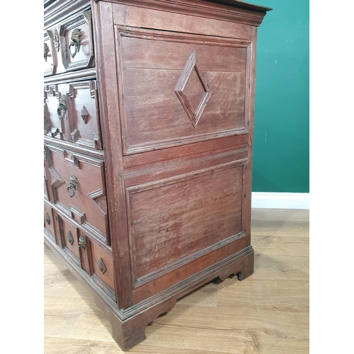 959 - An early 18th Century oak Chest of two short and three long drawers with moulded drawer fronts and m... 