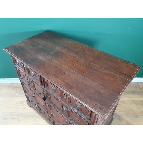 959 - An early 18th Century oak Chest of two short and three long drawers with moulded drawer fronts and m... 