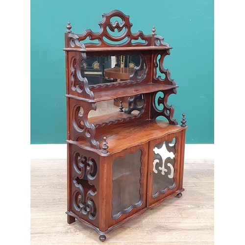 960 - A Victorian walnut Table Cabinet with mirror panels to the raised shelves and glass panels to the pa... 