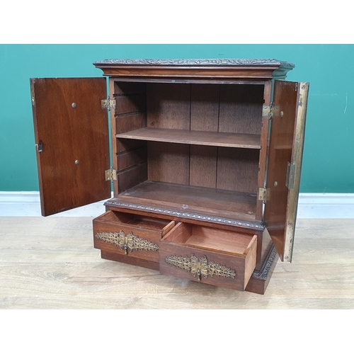 962 - An oak table top Cabinet with pair of doors set oval mirror panels, above two drawers, 1ft 11in H x ... 