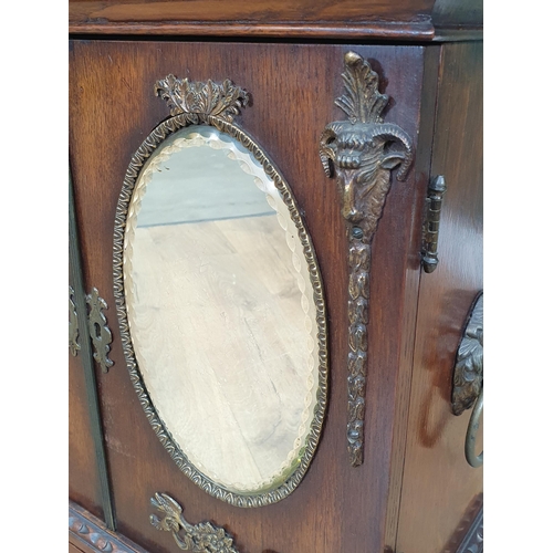 962 - An oak table top Cabinet with pair of doors set oval mirror panels, above two drawers, 1ft 11in H x ... 