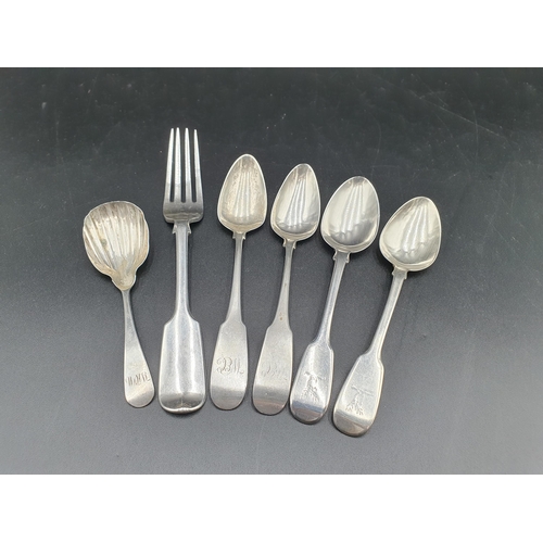 98 - An Irish silver Caddy Spoon with scallop bowl engraved initials,  a silver Fork and three Teaspoons ... 