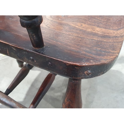 487 - A Smokers Bow Elbow Chair on turned supports and double H stretcher. A/F. (Please note - Damage/Repa... 