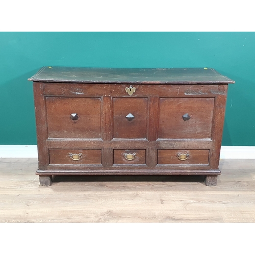 566 - An 18th Century oak Mule Chest with three panel front above three drawers, dated and initialled 'S.M... 