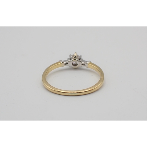 161 - A Diamond Ring claw-set brilliant-cut stone. estimated 0.20ct, between tapered baguettes to shoulder... 