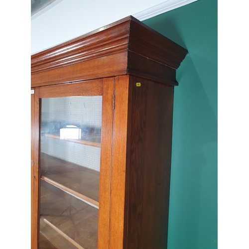 149 - An oak glazed top Dresser, with moulded cornice above pair of glazed doors enclosing three fitted sh... 