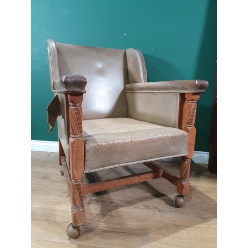 644 - A leather open Armchair with oak supports 2ft 11in H x 2ft 2in W (R6)