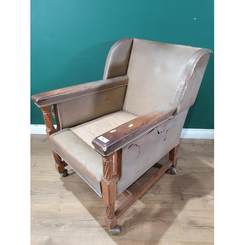 644 - A leather open Armchair with oak supports 2ft 11in H x 2ft 2in W (R6)