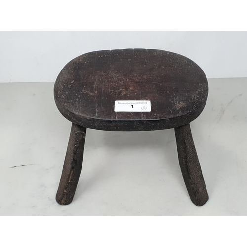 1 - An antique primitive Milking Stool 8 1/4in W x 6 1/2in H and a pair of treen miniature wooden Shoes ... 