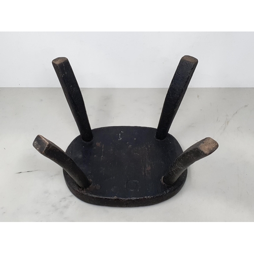 1 - An antique primitive Milking Stool 8 1/4in W x 6 1/2in H and a pair of treen miniature wooden Shoes ... 