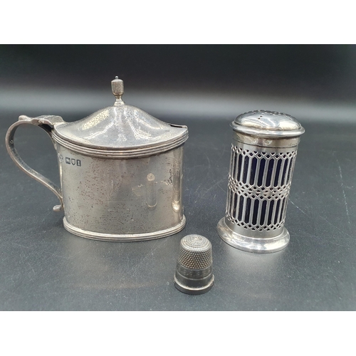 104 - An Edward VII silver oval Mustard Pot, London 1906, a Pepperette, Birmingham 1926 and a Thimble, Bir... 