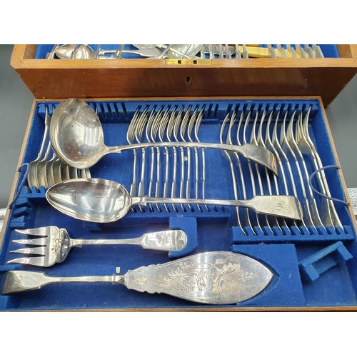 105 - A part Canteen of Victorian plated cutlery fiddle pattern engraved initials, includes soup ladle, tw... 