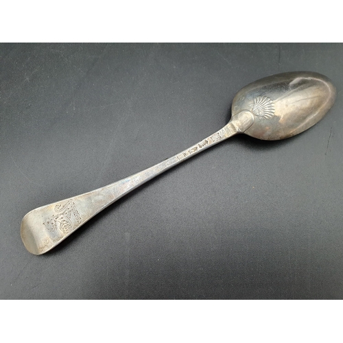 109 - A George II silver bottom marked Table Spoon Hanoverian pattern with shell pattern back, engraved cr... 