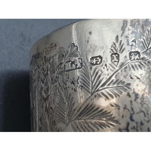 126 - A Victorian silver Christening Mug embossed floral swags, Sheffield 1867, and another, leafage engra... 