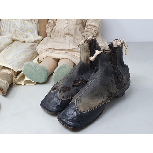 14 - Two fabric Dolls, a doll's straw Hat and a pair of antique doll's Boots