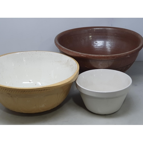 2 - A stoneware Mixing Bowl with incised decoration, two other Mixing Bowls, a Pie Dish and a Colander