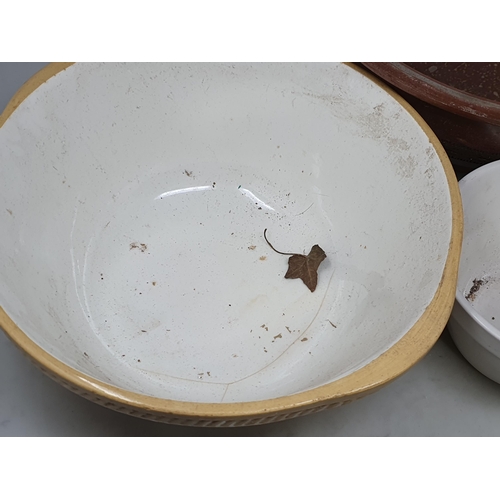 2 - A stoneware Mixing Bowl with incised decoration, two other Mixing Bowls, a Pie Dish and a Colander