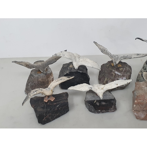 24 - Nine painted metal models of Gulls on stone bases