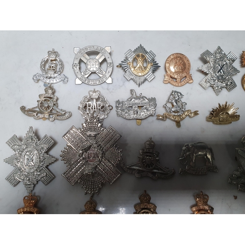 261 - A collection of approximately 50 Military Badges