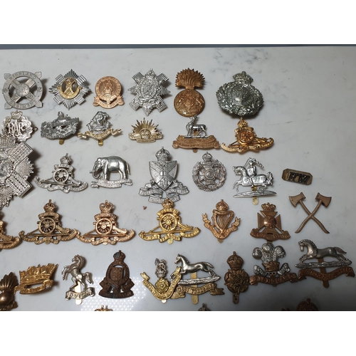 261 - A collection of approximately 50 Military Badges