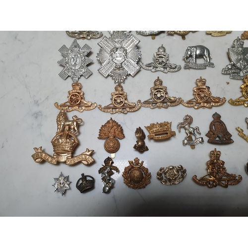 261 - A collection of approximately 50 Military Badges