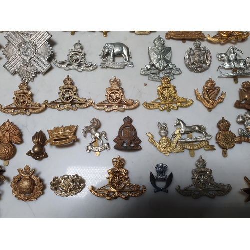 261 - A collection of approximately 50 Military Badges