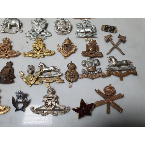 261 - A collection of approximately 50 Military Badges