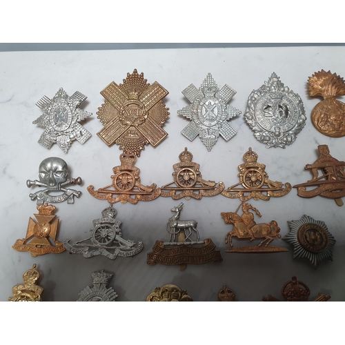 262 - A collection of approximately 50 Military Badges