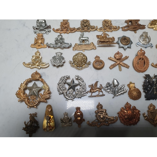 262 - A collection of approximately 50 Military Badges